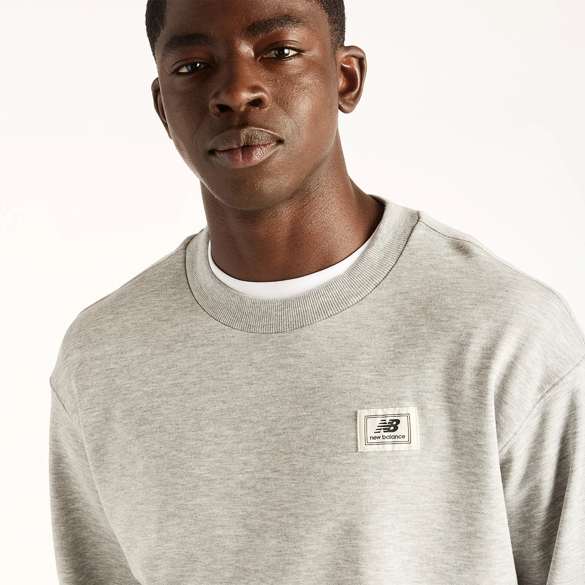 NEW BALANCE WOVEN LABEL SWEAT